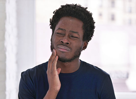 Man experiencing tooth pain